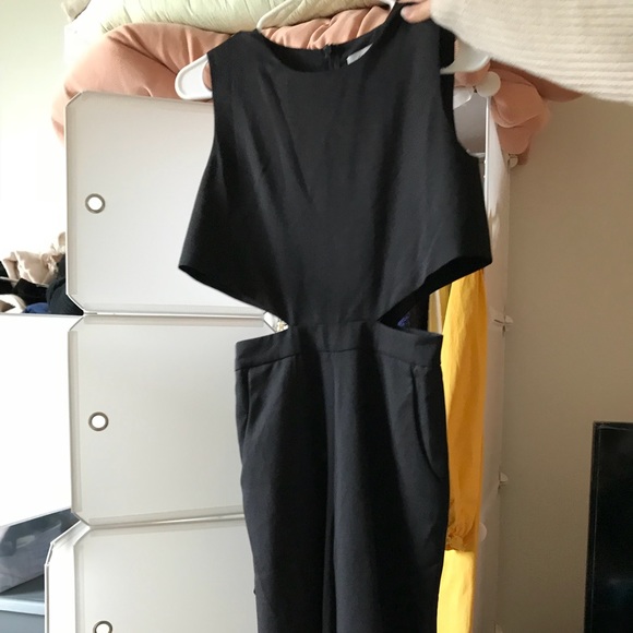 black jumpsuit with hollow out at the waist. - Picture 1 of 3